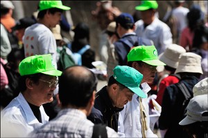 Men in green caps